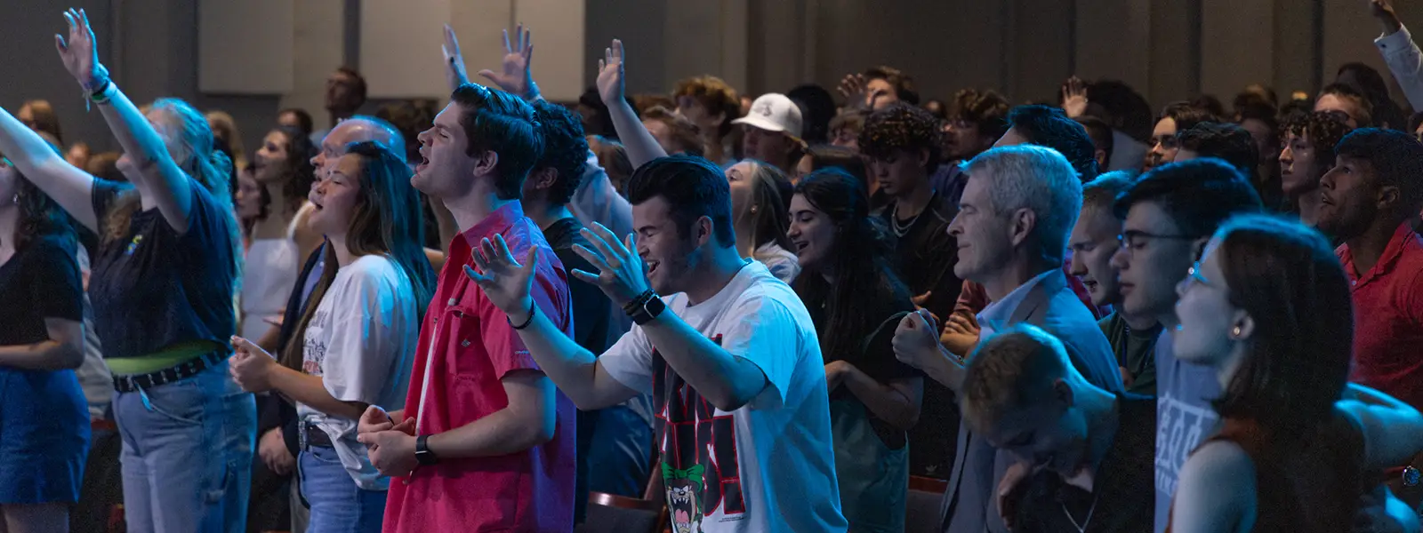 Students worshipping in chapel on campus